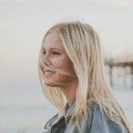 A young photographer captures the serene beach vibes at sunset in Gaviota, California.